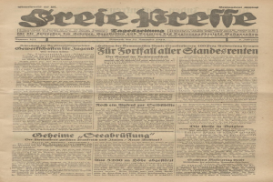 Schwarze und weiße Titelseite einer alten deutschen Zeitung mit einem ernst dreinblickenden Mann, der direkt in die Kamera schaut.