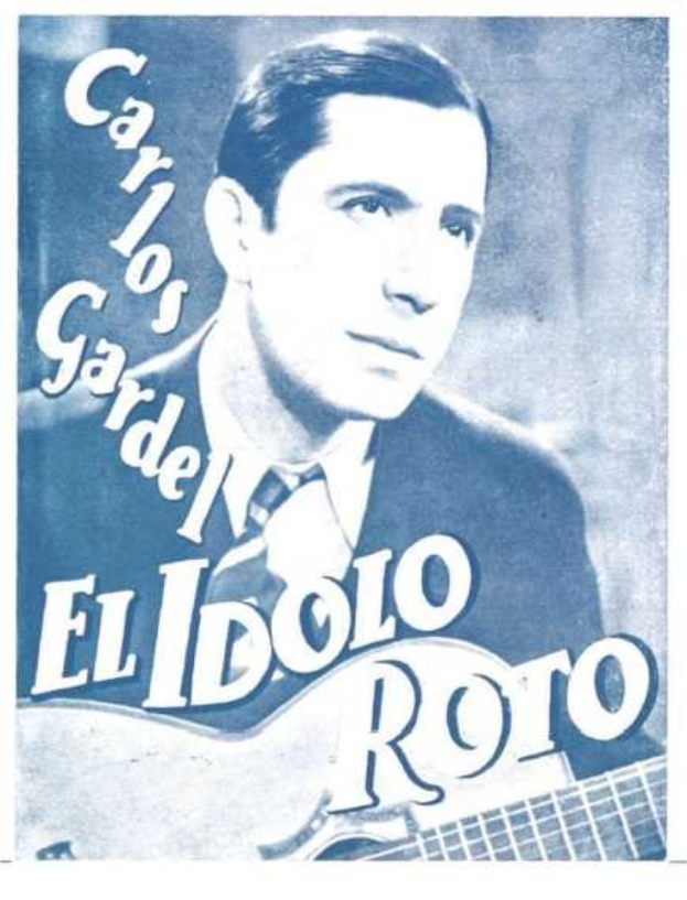 Ein Plakat des spanischen Singer-Songwriters El Idolo Roro, der eine Gitarre hält, ein weißes Hemd und einen schwarzen Anzug trägt, mit hellblauem Hintergrund und fetter schwarzer Schrift.