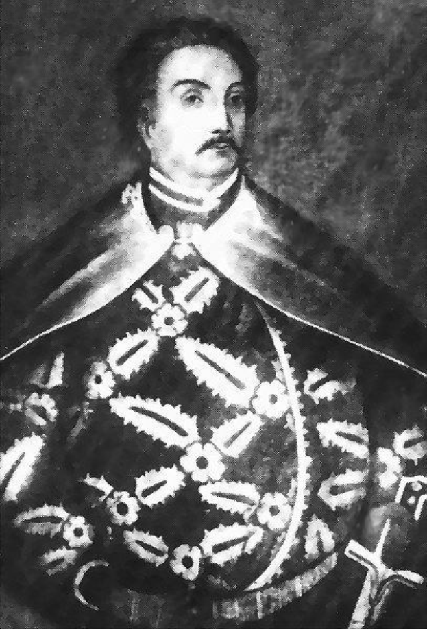 Schwarzes und weißes Foto von Papst Johannes Paul II. in Priesterrobe, der eine schwarze Robe mit weißem Kragen und Manschetten trägt, Hände gefaltet, strenger Ausdruck, direkter Blick.