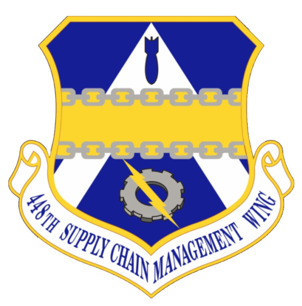 Logo des 48. Versorgungsmanagementflügels mit einem blauen Schild mit einem weißen Stern, einem weißen Banner mit blauer Schrift 'Versorgungsmanagement' und schwarzer Schrift '48. Versorgungsmanagementflügel' in fetter Schrift.